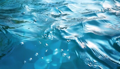 Wall Mural - bluewater waves on the surface ripples blurred defocus blurred transparent blue colored clear calm water surface texture with splash and bubbles water waves with shining pattern texture background