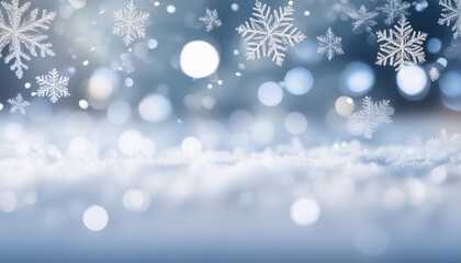 Wall Mural - gentle snowflakes fall against a soft blue and gray bokeh background evoking a serene winter atmosphere