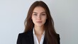 © ME_Photography - A brunette woman with long hair presents a neutral expression while wearing a suit against a plain white backdrop.