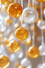 Wall Mural - Close-up of hanging spherical ornaments in white and gold, creating a shimmering microcosm effect with soft lighting