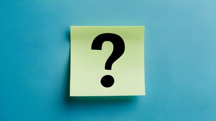 A sticky note with a black question mark drawn on it.