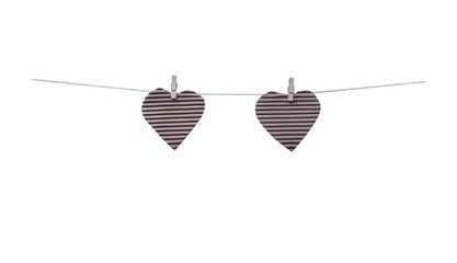 Empty two brown paper in heart shape patterns hang on wood cloth clip and white string line isolated on white background , clipping path for picture album or documentation