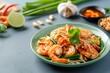 © ibhonk - Close-up of Pad Thai Noodles with Shrimp and Bean Sprouts