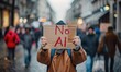 © piai - Protester Holding 'No AI' Sign During Demonstration