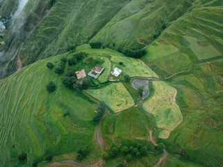 Wall Mural - Aerial view of beautiful high altitude forest grassland mountain landscape