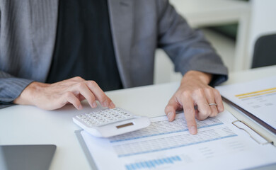 Confident asian business man Auditor or internal revenue service staff checking annual financial statements company Audit  Accounting tax.