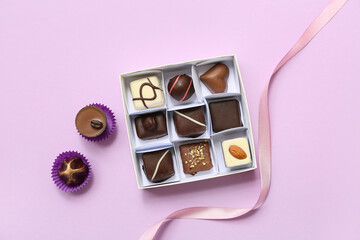 Sticker - Box with delicious candies on purple background