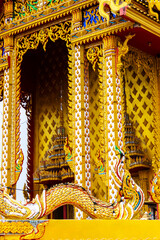 Wall Mural - Traditional Thai style golden stucco in Thai temple