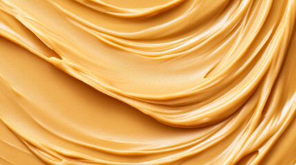 Wall Mural - Closeup of a smooth, smeared peanut butter background with rich, creamy textures and a light golden hue 