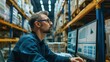 © Borin - A supply chain manager analyzing stock levels on a computer screen.