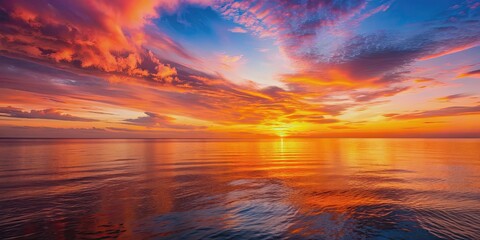 Wall Mural - beautiful sunset over calm ocean with orange and pink hues reflecting on water, sunset, ocean, calm,