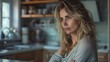 © Generative AI - Pensive thoughtful woman with distressed mood stands in kitchen of home Anxiety fear Tired frustrated blonde woman feel bad looking sadly away Midlife crisis despair sadness negative e : Generative AI