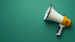 © Tanakrit - Photo of a white orange megaphone on a green background for Marketing and Advertising