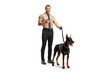 © Ljupco Smokovski - Security officer holding a walkie talkie and a doberman dog on a lead