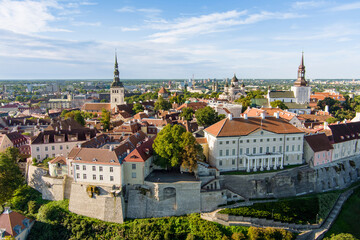 Wall Mural - Iconic aerial skyline view of Tallinn Old Town and Toompea hill on a sunny summer evening. Stenbock House, Patkuli viewing platform, defensive walls, rooftops.