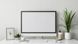 © Rabiyah - Creative Office Space Mock-Up with Horizontal Blank Frame, Computer Equipment, and White Color Theme