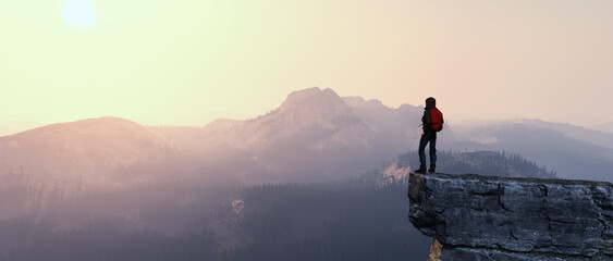 Wall Mural - Hiker on top of a mountain.