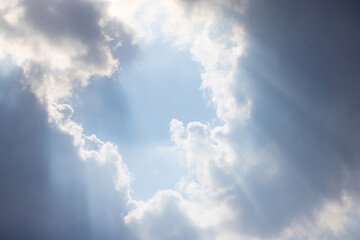 Wall Mural - the sky is filled with clouds and the sun is shining through them