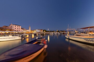 Canvas Print - Picture over the harbor of Fazana in Istria in the evening during sunset