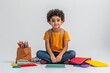© Dina - Back to school. Young boy of Middle Eastern descent looking excited as he sits on the floor with new school supplies spread around him, minimal style with copy space. First day. Private and public.