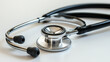 © Curioso.Photography - A close-up photo of a stethoscope, representing healthcare and medical examination, set against a white background.