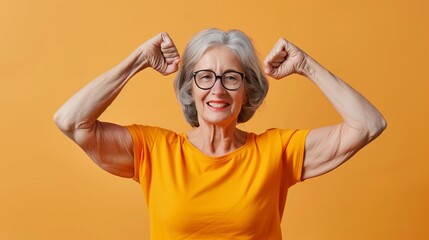 Senior grey-haired woman wearing casual clothes showing arms muscles smiling proud. fitness concept.