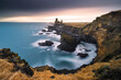 © robertharding - The splendid basalt rock cliff of Londrangar, taken with a long exposure on a cold winter day, Iceland, Polar Regions