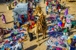 © robertharding - Camel loaded with firewood walking through the colourful Monday market of Keren, Eritrea, Africa