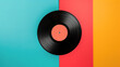 © Дмитрий Симаков - A black record sits on a colorful background