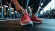 © AlfaSmart - Woman tying her shoelaces on a pair of running shoes