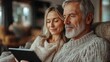 © Neural Pixels - A couple sits closely, sharing a moment while using a tablet in their comfortable living room