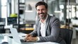 © PixelProAI - Portrait of a smiling businessman working on a laptop
