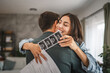 © Miljan Živković - emotional couple hug each other and hold ultrasound picture of baby