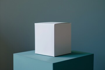 Fototapete - A minimalist image showing a white cube placed atop a teal platform, capturing the simplicity and elegance of geometric shapes with soft lighting and subtle shadows.