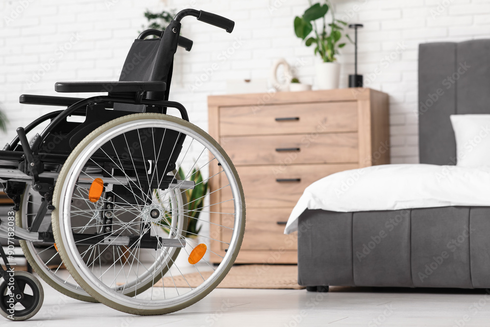 Empty wheelchair in bedroom