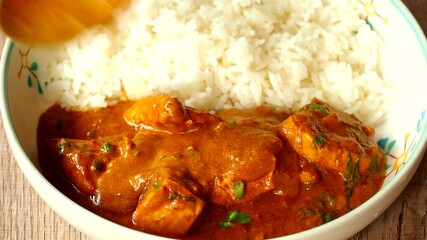 Wall Mural - Chicken tikka masala with rice, in door Chiangmai Thailand.