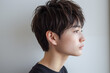 © wazamai - profile of young japanese man with short tousled hair and calm expression
