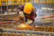 © NORN - Welder in Safety Gear Working with Bright Sparks.