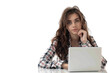 © venusvi - Businesswoman feeling stressed, laptop in front, isolated on white background