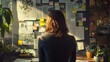 © vitanovski - Woman standing in front of wall with sticky notes and brainstorming ideas