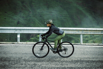 Wall Mural - Riding bike on grassland mountain top trail