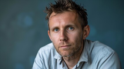 Portrait of a positive European male on a solid background