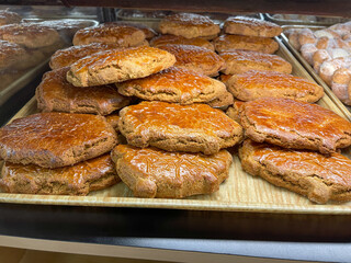 A tray full of puerquitos or cochinitos (gingerbread pig cookies) on display at a Mexican bakery. Traditional Mexican sweet bread (pan dulce Mexicano).