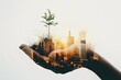 © EdvvinStudios - Hand holding growing sustainable cityscape at sunset
