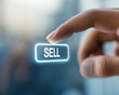 © RobertNyholm - Finger pushing down on a button with the text sell