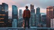 © Iswanto - Man standing on rooftop overlooking city skyline.