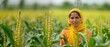 © Phuwameth - Woman in Yellow Scarf Standing in Cornfield