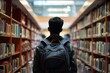 © MG - Back view of male student wearing backpack, standing in library, showcasing moment of reflection and preparation for an immersive study session, Generative AI