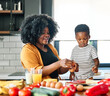 © Lumos sp - child family kitchen food boy son mother father breakfast preparing egg morning healthy diet eating home black african american father cooking, parent, cute, meal