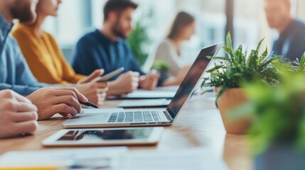 close-up of business professionals working together in a modern office environment. the team is enga